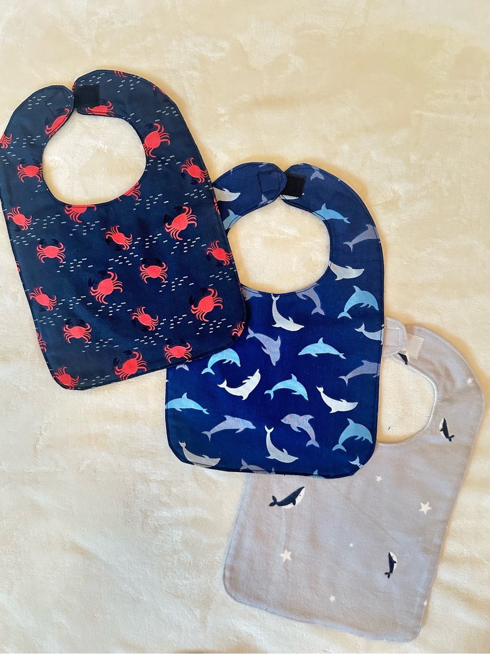 Three-Pack Kids Bibs in Navy, Blue & Gray with Crab, Dolphin & Shark Prints